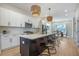 Modern kitchen featuring a large island, stainless steel appliances, and pendant lighting at 916 Ira Sw St, Atlanta, GA 30310