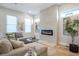 Bright living room with a fireplace, comfortable seating, and a decorative glass table at 916 Ira Sw St, Atlanta, GA 30310