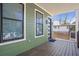 Charming green porch with railings, a wooden deck, and a view of the surrounding neighborhood at 916 Ira Sw St, Atlanta, GA 30310