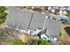 An aerial shot of a residential property showcasing its roof, yard, and surrounding neighborhood at 2415 Clock Face Ct, Lawrenceville, GA 30043