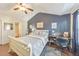 Comfortable bedroom featuring vaulted ceiling, ensuite bath, and writing desk at 2415 Clock Face Ct, Lawrenceville, GA 30043