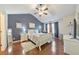 Cozy bedroom with a sloped ceiling, a ceiling fan, and hardwood flooring at 2415 Clock Face Ct, Lawrenceville, GA 30043