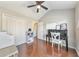 Bedroom featuring a ceiling fan, hardwood flooring, and ample closet space at 2415 Clock Face Ct, Lawrenceville, GA 30043