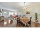 Comfortable dining area with hardwood floors, neutral tones, and elegant chandelier at 2415 Clock Face Ct, Lawrenceville, GA 30043