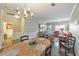 Open dining room with view of living room, featuring hardwood floors and modern decor at 2415 Clock Face Ct, Lawrenceville, GA 30043