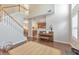 Open-concept living room flows into the kitchen, complemented with hardwood floors at 2415 Clock Face Ct, Lawrenceville, GA 30043