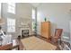 Bright living room featuring tall ceilings, fireplace, and ample natural light at 2415 Clock Face Ct, Lawrenceville, GA 30043