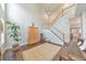 Spacious living room with fireplace, staircase, and tall ceilings creates an open feel at 2415 Clock Face Ct, Lawrenceville, GA 30043