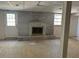 Spacious unfinished basement with brick fireplace and good lighting at 2475 Freydale Se Rd, Marietta, GA 30067