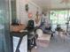 Relaxing sunroom with brick accent wall, plenty of room for seating, and screened windows at 2475 Freydale Se Rd, Marietta, GA 30067