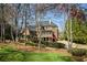 Backyard view of the property, landscaping, and exterior elevation, emphasizing outdoor living spaces at 3180 Wills Mill Rd, Cumming, GA 30041