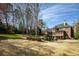 View of the backyard, landscaping, patio, and exterior of the home, highlighting outdoor living at 3180 Wills Mill Rd, Cumming, GA 30041