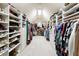 Organized walk-in closet featuring custom shelving and ample storage for clothes and shoes at 3180 Wills Mill Rd, Cumming, GA 30041