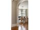 Formal dining room with modern chandelier, hardwood floors, and ample natural light at 3180 Wills Mill Rd, Cumming, GA 30041