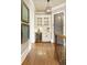 Stylish hallway with wine storage, hardwood floors, and decorative wall decor at 3180 Wills Mill Rd, Cumming, GA 30041