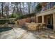 Enjoy this outdoor kitchen bar with seating, stone surround, and outdoor lighting near the swimming pool at 3180 Wills Mill Rd, Cumming, GA 30041