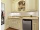 Charming wet bar features custom cabinets, granite countertop, and beverage cooler at 3180 Wills Mill Rd, Cumming, GA 30041