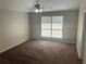 Spacious bedroom featuring a ceiling fan and a large window for natural light at 503 N Shore Rd, Lithonia, GA 30058