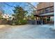 Exterior view of the backyard with a deck, parking, and mature trees at 648 Cooledge Ave, Atlanta, GA 30306