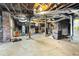 Unfinished basement with exposed ductwork, brick columns, and utilities at 648 Cooledge Ave, Atlanta, GA 30306