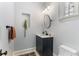 Stylish powder room featuring a modern vanity, decorative mirror, and contemporary finishes at 648 Cooledge Ave, Atlanta, GA 30306