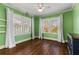 Sunny bedroom with large windows, hardwood floors, and neutral window treatments at 648 Cooledge Ave, Atlanta, GA 30306