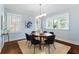 Cozy dining area featuring a wooden table, modern chairs, and bright natural light at 648 Cooledge Ave, Atlanta, GA 30306