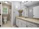 Bathroom with granite counters, white cabinets, and vanity lighting at 76 Barrington Farms Pkwy, Sharpsburg, GA 30277