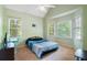 Bright bedroom with natural light from multiple windows and pitched ceiling at 76 Barrington Farms Pkwy, Sharpsburg, GA 30277