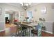 Inviting dining room adjacent to the living room with modern decor and ample natural light at 76 Barrington Farms Pkwy, Sharpsburg, GA 30277