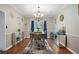 Bright dining room featuring modern lighting, stylish decor, and hardwood flooring at 76 Barrington Farms Pkwy, Sharpsburg, GA 30277