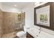 Updated bathroom with beautiful tile work, a glass enclosed shower, and modern fixtures at 124 The Prado, Atlanta, GA 30309