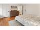 Bedroom with wood floors, neutral rug, and view to the ensuite bathroom at 124 The Prado, Atlanta, GA 30309