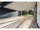 Carport area with a concrete base and wooden supports to the side of the house at 124 The Prado, Atlanta, GA 30309
