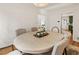 Dining room with hardwood floors and view into adjacent kitchen at 124 The Prado, Atlanta, GA 30309