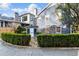 Rear exterior of a home with manicured hedges and a charming garden shed at 124 The Prado, Atlanta, GA 30309