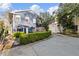 Charming home exterior featuring a lush garden, a neatly manicured yard and a driveway at 124 The Prado, Atlanta, GA 30309