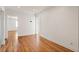 Hallway with hardwood flooring and multiple doorway entrances into other rooms at 124 The Prado, Atlanta, GA 30309