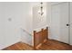 Hallway features hardwood floors, chandelier, and neutral walls at 124 The Prado, Atlanta, GA 30309