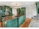 Gourmet kitchen with granite countertops, modern appliances, and custom green cabinetry at 124 The Prado, Atlanta, GA 30309