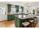 Open kitchen with granite counters, an island cooktop, and seating for three at 124 The Prado, Atlanta, GA 30309