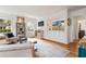 Bright living room featuring hardwood floors, neutral decor, and kitchen access at 124 The Prado, Atlanta, GA 30309