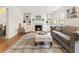 Bright living room with fireplace, built-in shelving, and hardwood floors at 124 The Prado, Atlanta, GA 30309