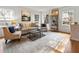 Sun-drenched living room featuring hardwood floors, stylish furniture, and bright interior at 124 The Prado, Atlanta, GA 30309