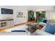 Bright living room featuring kitchen view, stylish furniture, and neutral decor at 124 The Prado, Atlanta, GA 30309
