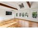 Large main bedroom featuring a vaulted ceiling, hardwood floors, and lots of light at 124 The Prado, Atlanta, GA 30309