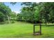 Picturesque park featuring a swing bench, benches and mature trees in a tranquil setting at 124 The Prado, Atlanta, GA 30309