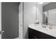 Bathroom with a white vanity, dark cabinets, white countertop and silver faucet at 1968 Perry Nw Blvd, Atlanta, GA 30318