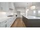 Modern kitchen with white cabinets, countertops, stainless steel appliances, and a central island at 204 Wakehurst Way, Marietta, GA 30064