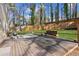 Large backyard with a wood deck, pergola swing, grill and a wood fence at 2110 Laurel Mill Way, Roswell, GA 30076
